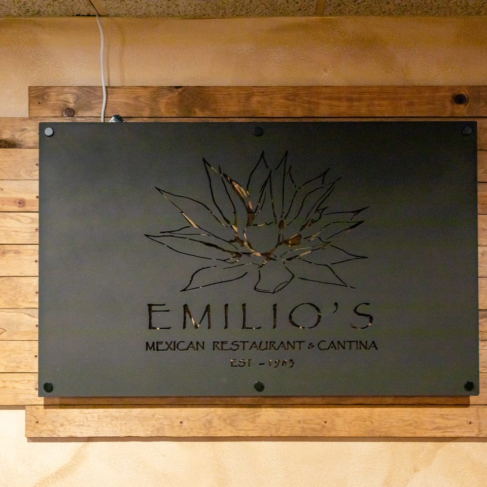 Wood-framed wall sign for Emilio’s Mexican Restaurant & Cantina, featuring an agave illustration and established 1983.
